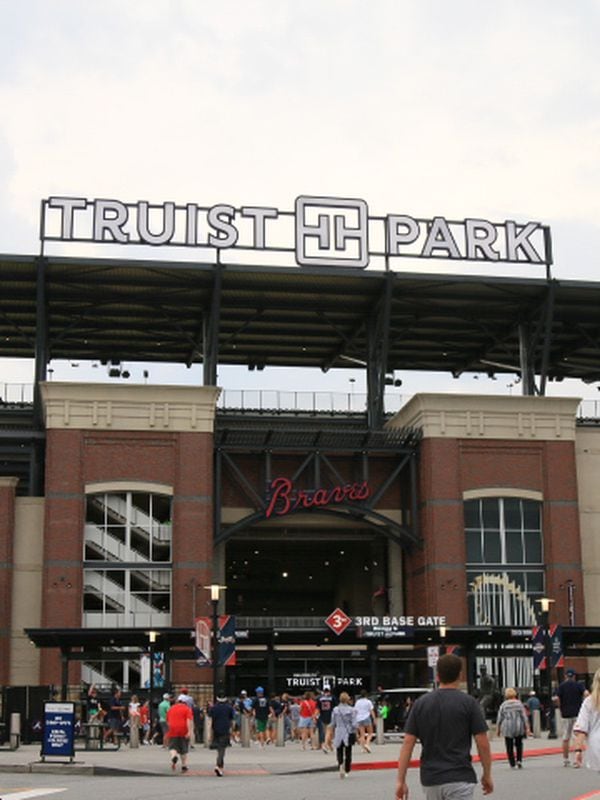 ATLANTA, GA - AUGUST 21: Fans line up to get inside Truist Park at